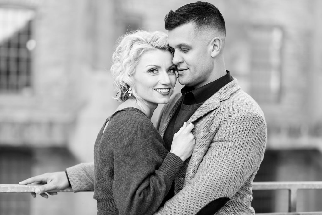 couple smiling at St. Anthony Main in Minneapolis for their engagement photos