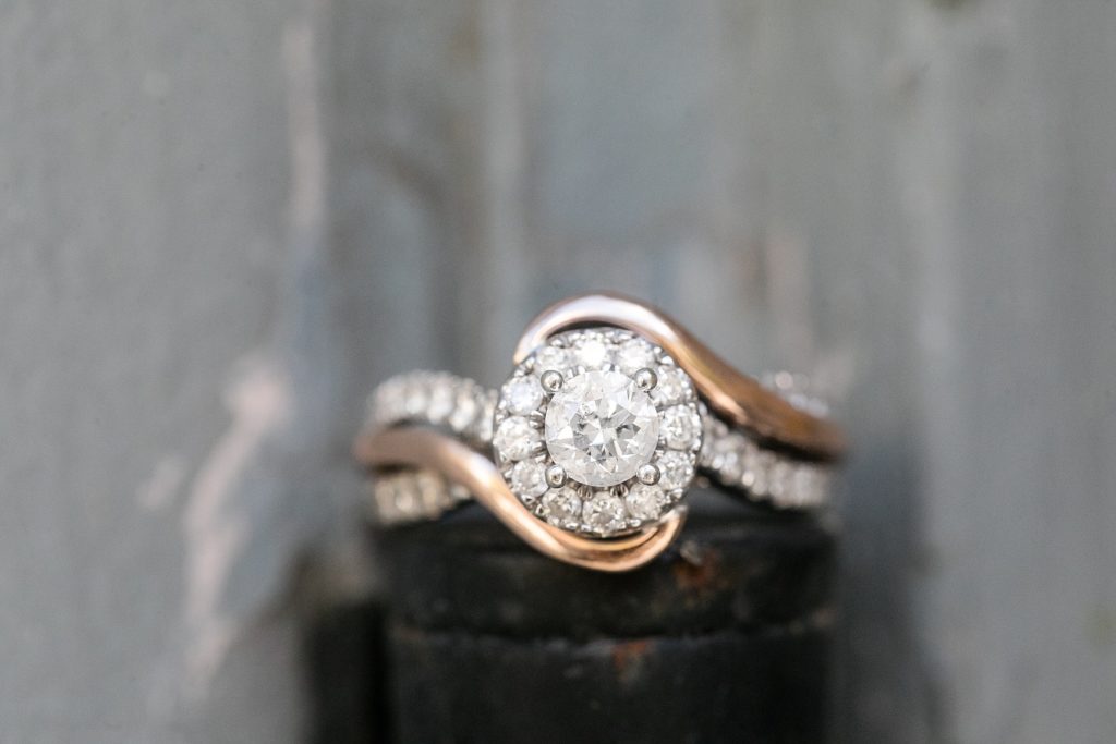 engagement ring with halo and rose gold at St. Anthony Main in Minneapolis for their engagement photos