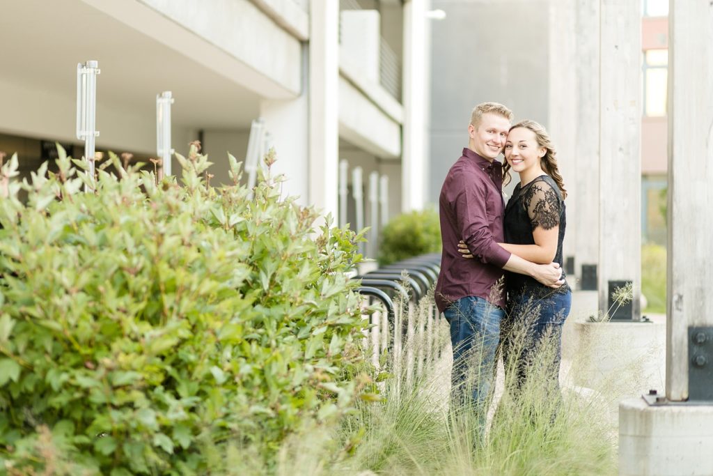 couple near the parking garage in Eau Claire for their engagement pictures 