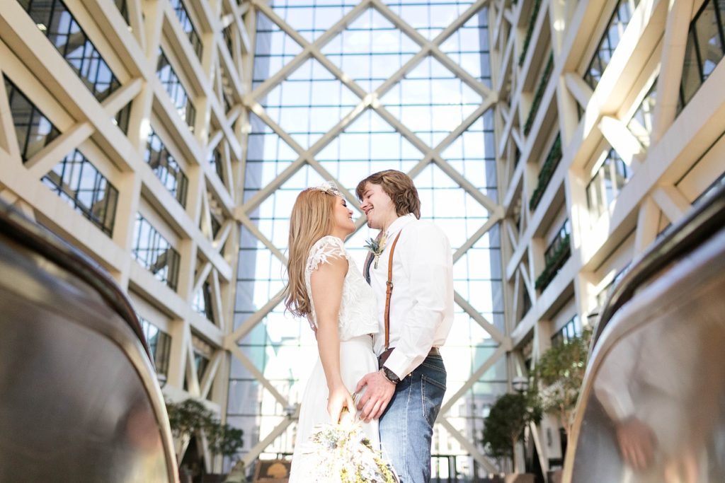couple in the atrium at the Hennepin County Government Center after having their Minneapolis courthouse wedding