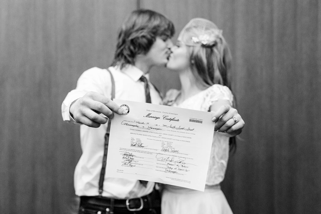 couple kissing in a courtroom at the Hennepin County Government Center after having their Minneapolis courthouse wedding
