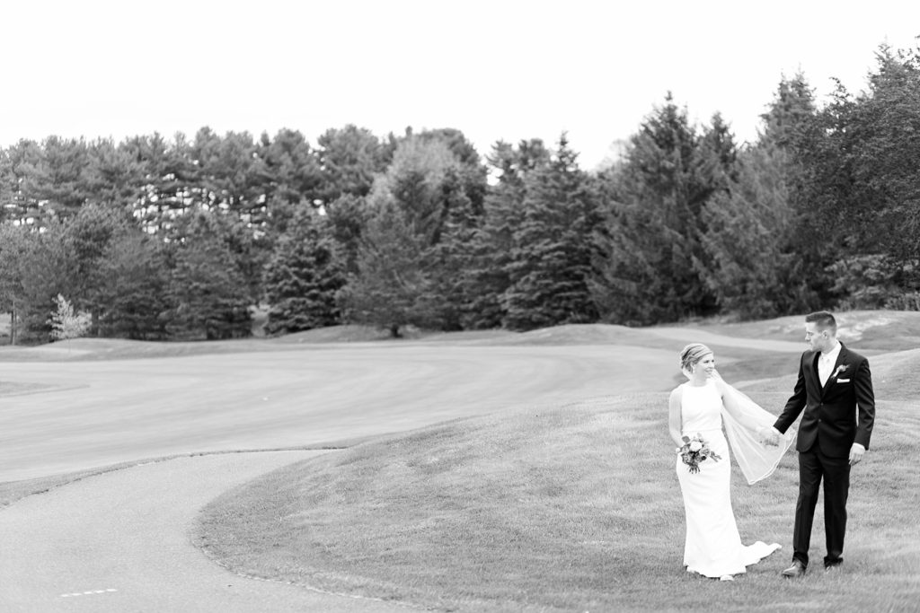 couple in black and white photo on their wedding day in Rice Lake, WI at Turtleback Golf
