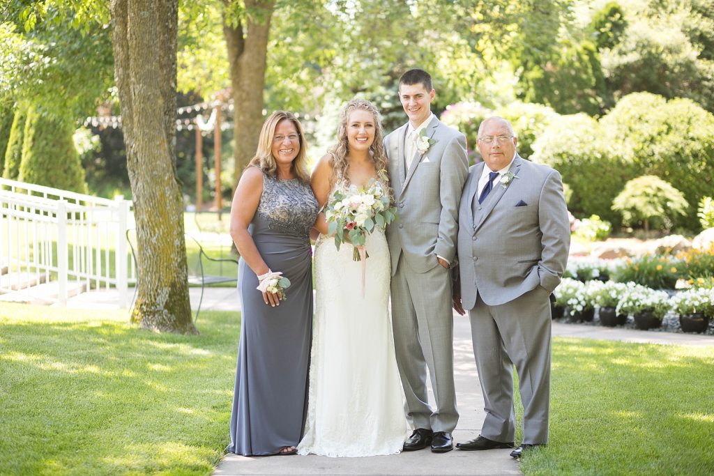 family portrait in the gardens for their summer wedding at The Florian Gardens in Eau Claire