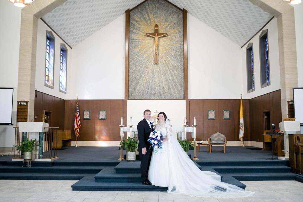 formal portrait of the bride and groom at Immaculate Conception Church in Eau Claire