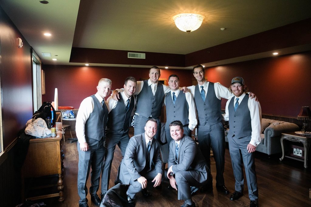 groom and groomsmen in the grooms room at Lilydale in Chippewa Falls during their fall wedding