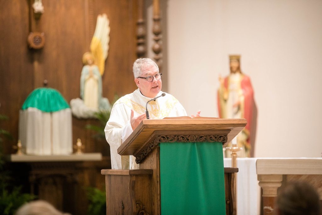 priest at St. Charles of Borromeo in Chippewa Falls for their wedding