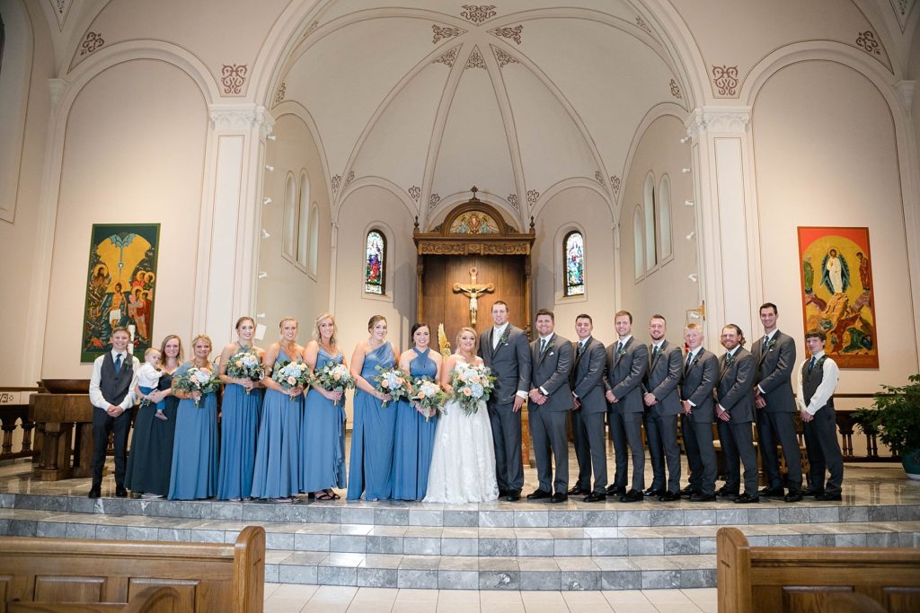 formal bridal party portrait at St. Charles of Borromeo in Chippewa Falls for their wedding