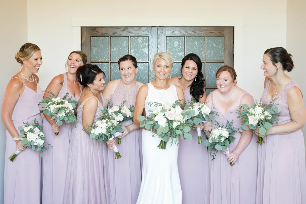bride and bridesmaids in the bridal suite laughing at Lilydale Dance Hall & Event Venue in Chippewa Falls