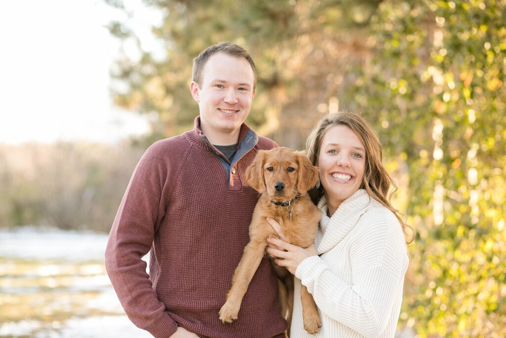 couple pose with golden retriever for their Eau Claire couples session with new puppy